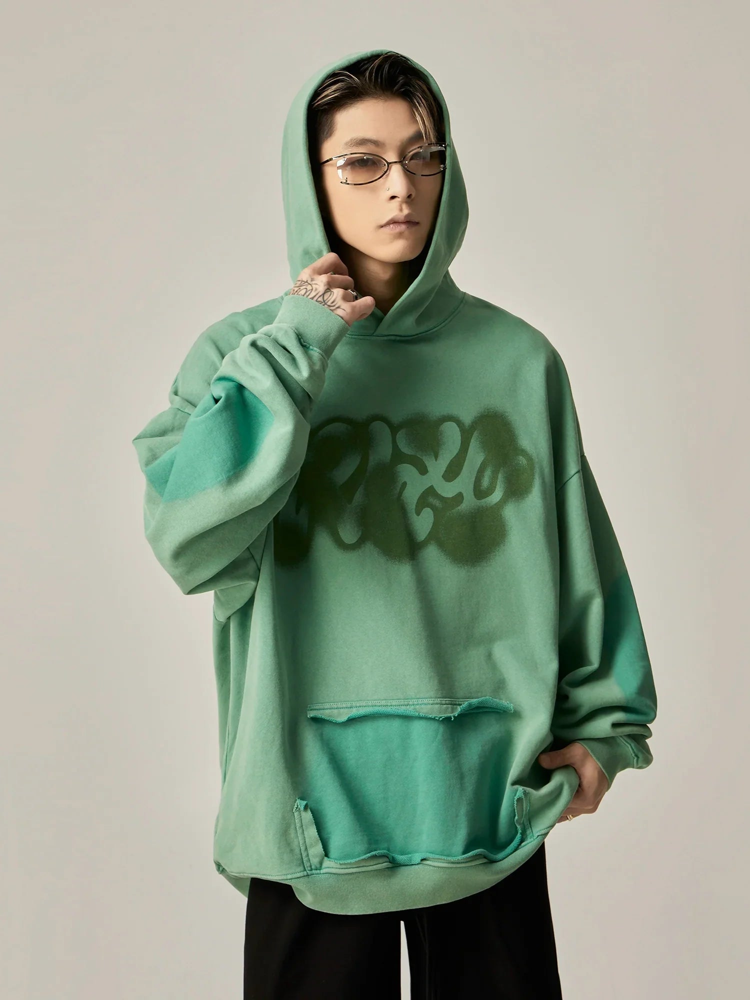 Oversized Mint Green Graffiti Hoodie with Distressed Details sneakershuborg